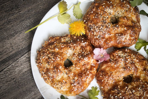 Bagels arranged on a plate.