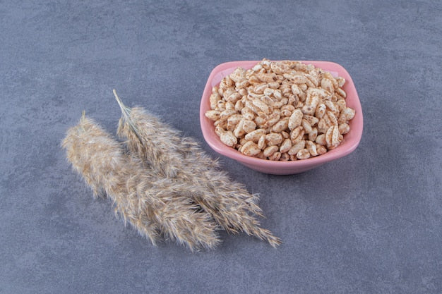 A bowl with organic groat oats.